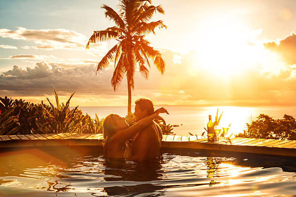 Couple-embracing-on-a-Caribbean-beach-at-sunset